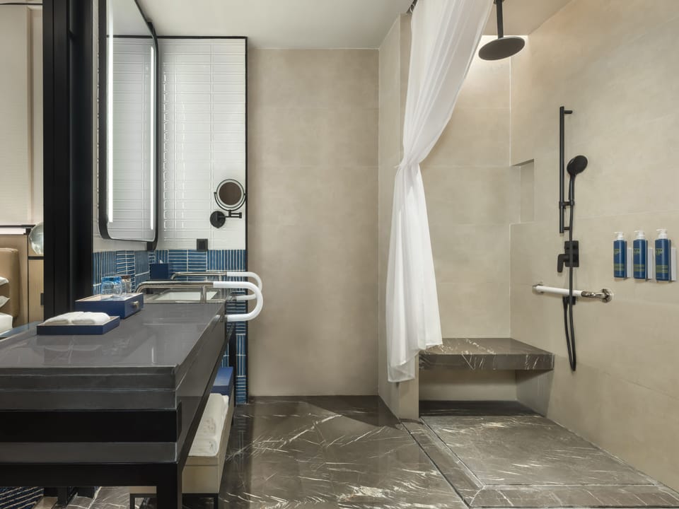 Designer toiletries, hair dryer, bathrobes, slippers