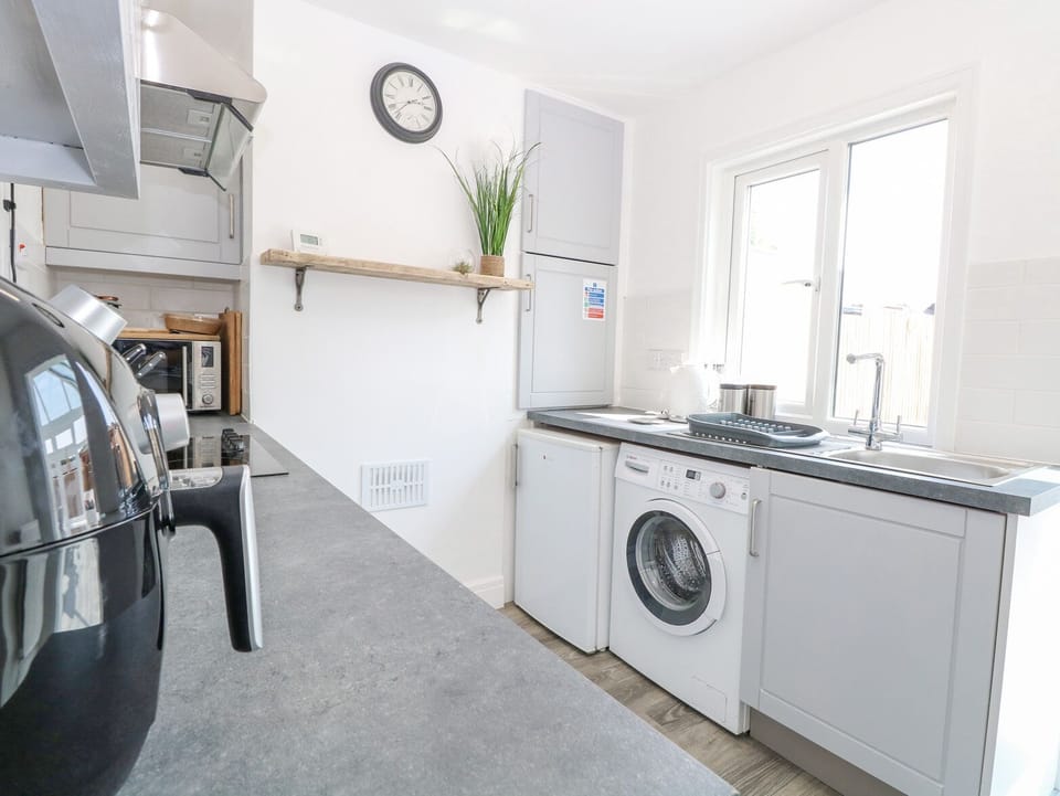 Fridge, electric kettle, toaster, cookware/dishes/utensils