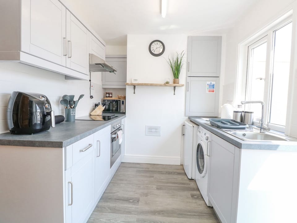 Fridge, electric kettle, toaster, cookware/dishes/utensils