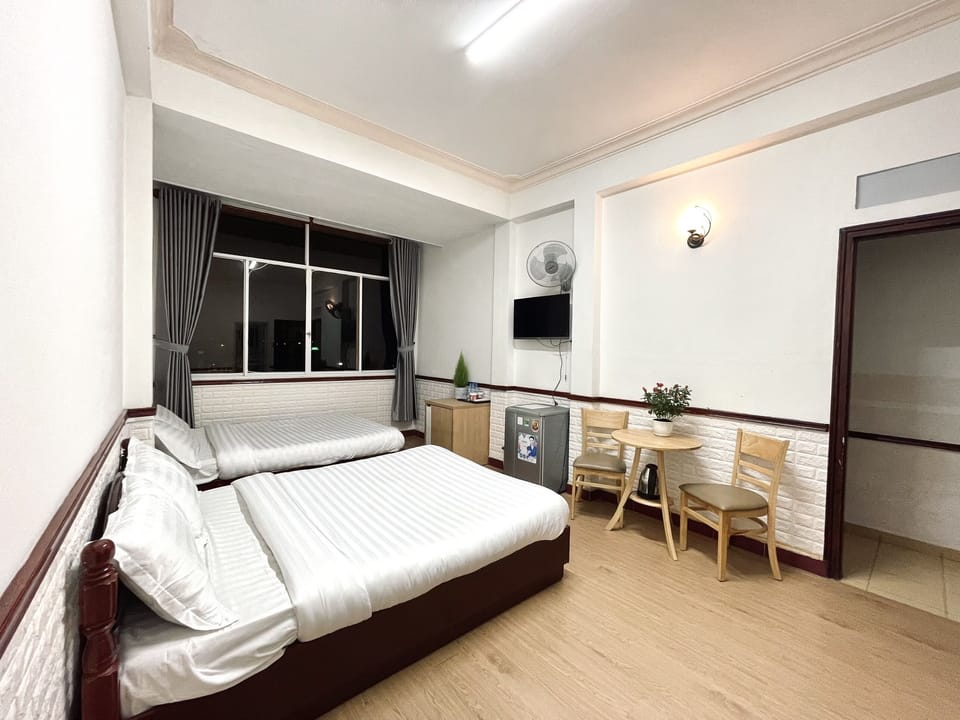 Superior Quadruple Room | Minibar, individually furnished, desk, laptop workspace