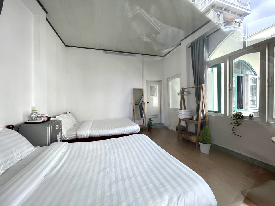 Superior Quadruple Room | Minibar, individually furnished, desk, laptop workspace
