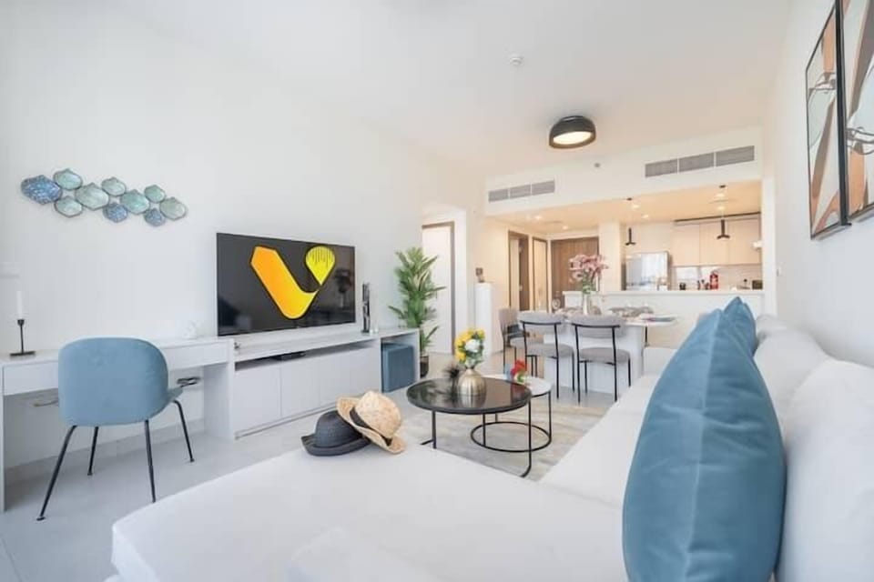 Superior Apartment | Living area | 65-inch Smart TV with cable channels