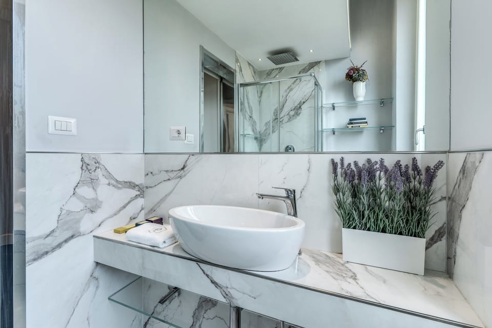 Apartment, Balcony, River View | Bathroom | Shower, rainfall showerhead, free toiletries, hair dryer
