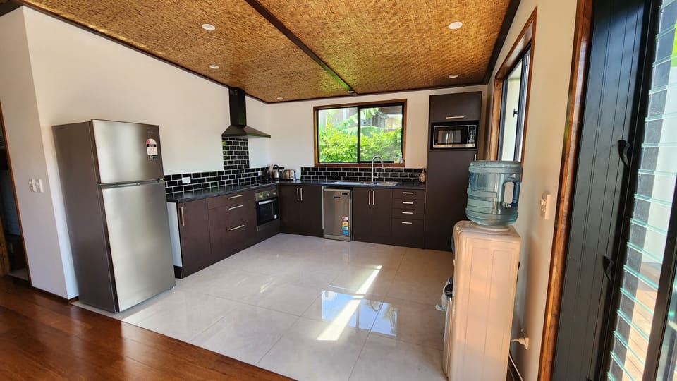 Comfort Suite | Private kitchen | Espresso maker, full-size fridge, microwave, oven