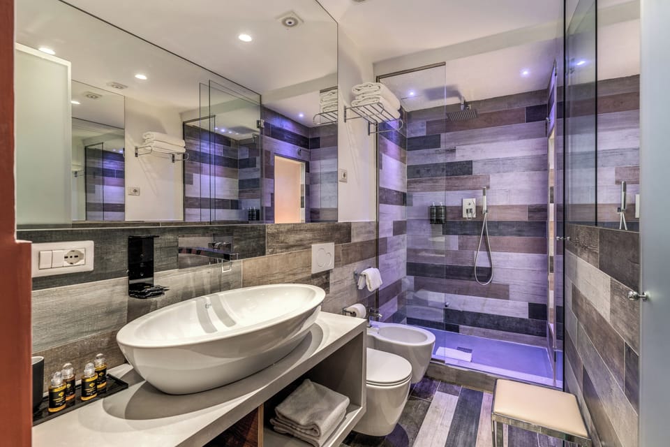 Deluxe Triple Room | Bathroom | Shower, rainfall showerhead, eco-friendly toiletries, hair dryer