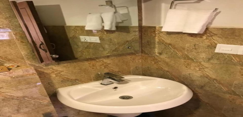Shower, rainfall showerhead, towels, soap