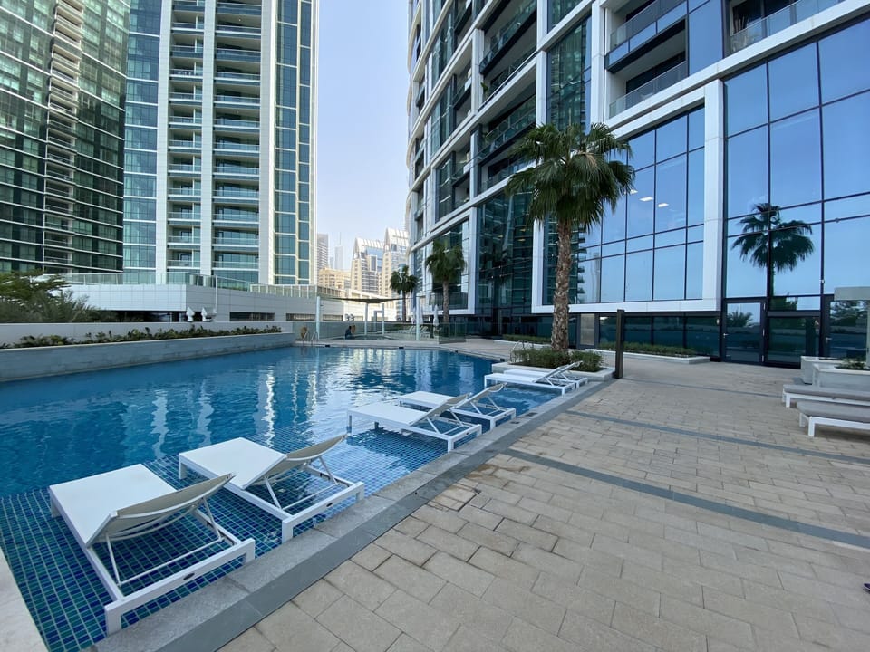 Outdoor pool, pool umbrellas, sun loungers