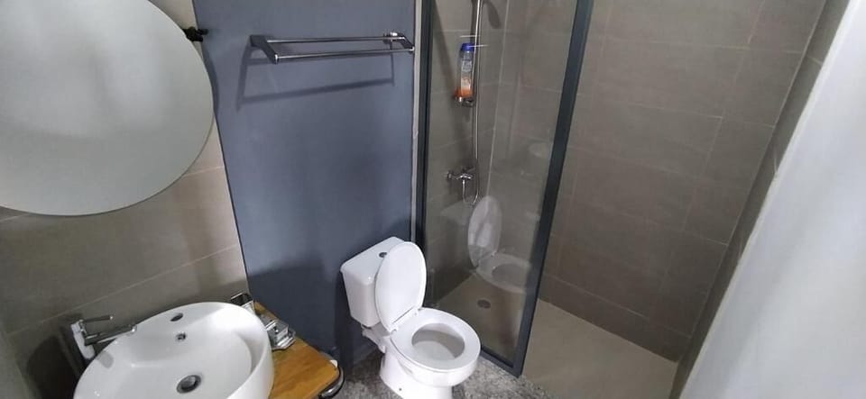 Shower, rainfall showerhead, towels, soap