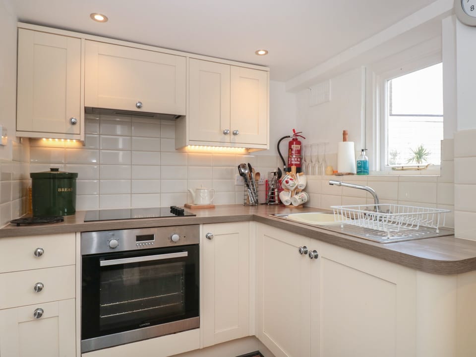 Fridge, electric kettle, toaster, cookware/dishes/utensils