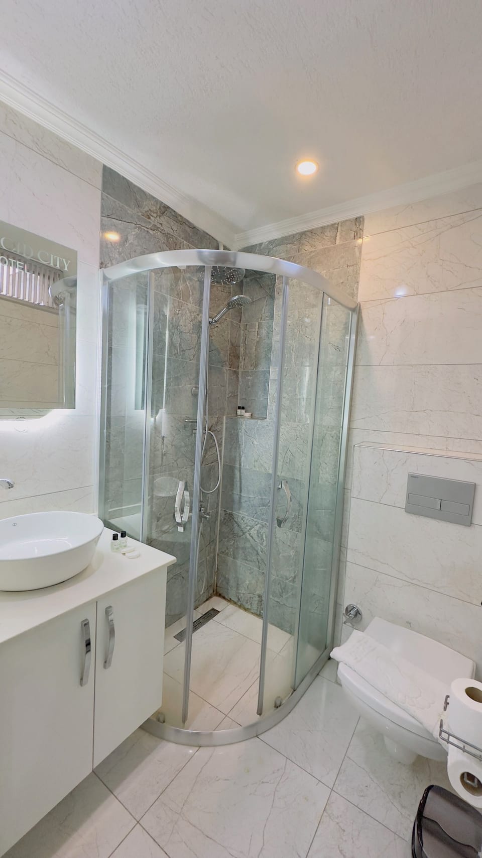 Shower, rainfall showerhead, designer toiletries, hair dryer