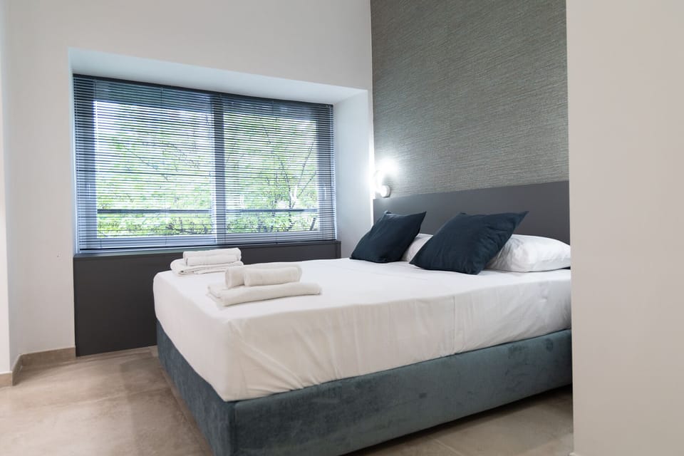 Deluxe Room, Multiple Beds, City View | Egyptian cotton sheets, premium bedding, down comforters, in-room safe
