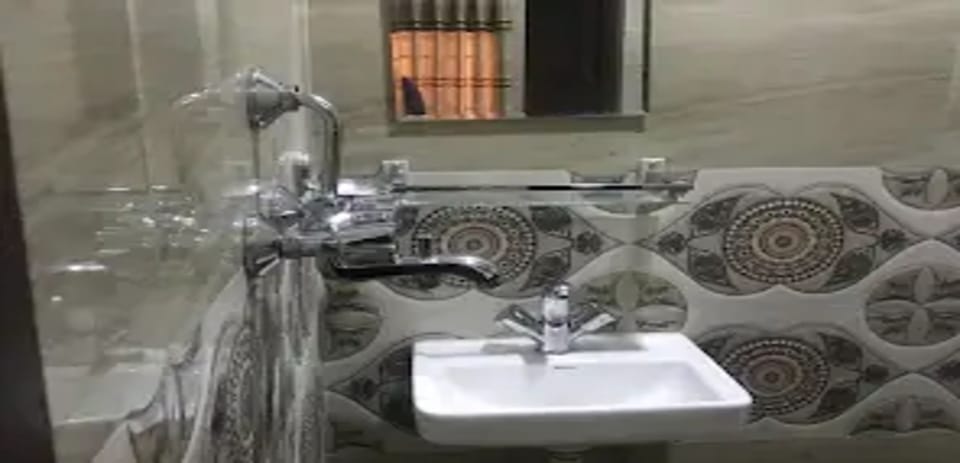Shower, rainfall showerhead, towels, soap