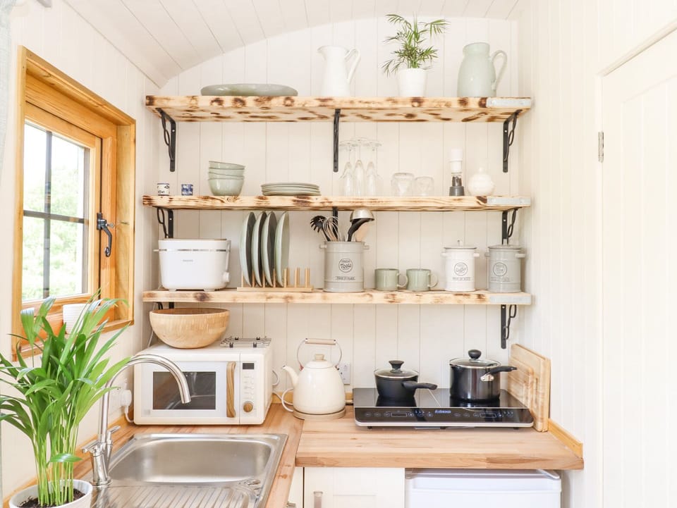 Fridge, electric kettle, toaster, cookware/dishes/utensils