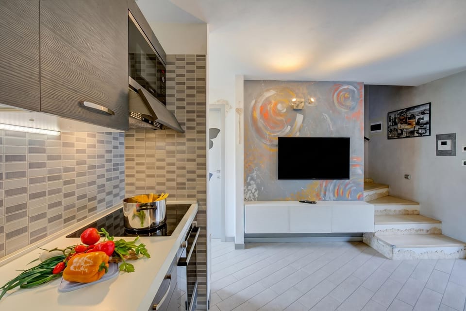 Family Apartment, Multiple Bedrooms (Casa Gio Few Minutes from the Lake) | Private kitchen | Fridge, microwave, oven, stovetop