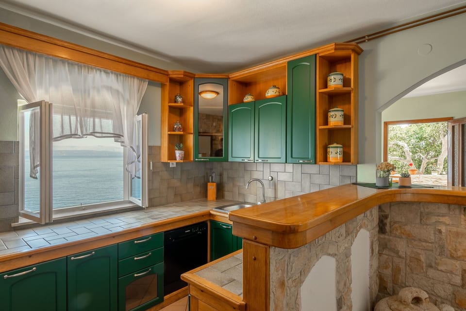 Villa | Private kitchen | Oven, electric kettle, toaster