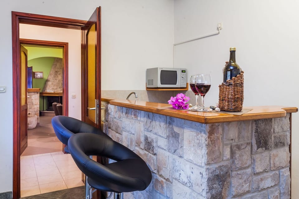 Villa | Private kitchen | Oven, electric kettle, toaster