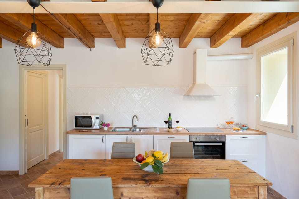 Villa | Private kitchen | Full-size fridge, microwave, oven, dishwasher