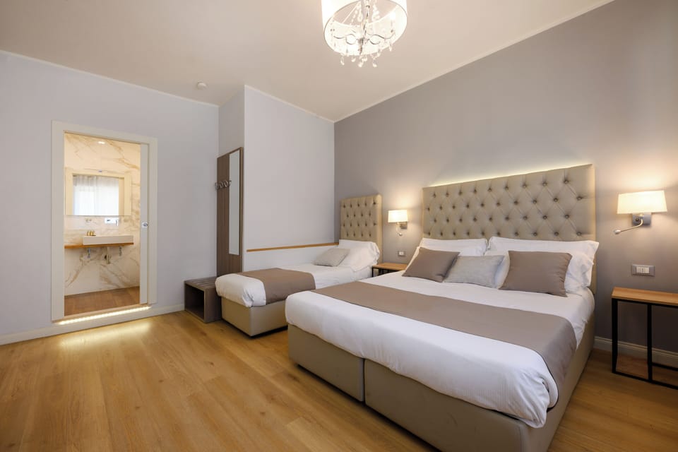 Family Triple Room | In-room safe, desk, laptop workspace, soundproofing