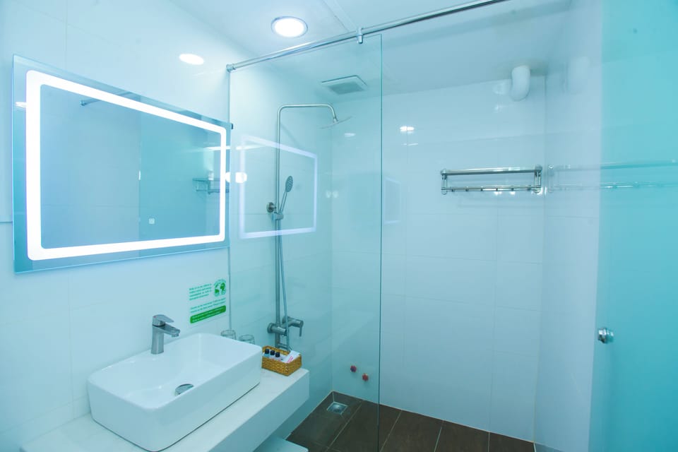 Premium Quadruple Room, 1 Bedroom, City View | Bathroom | Hair dryer, slippers, towels, soap