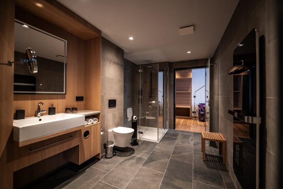 Exclusive Studio Suite, Mountainside | Bathroom | Hair dryer, towels, soap, shampoo