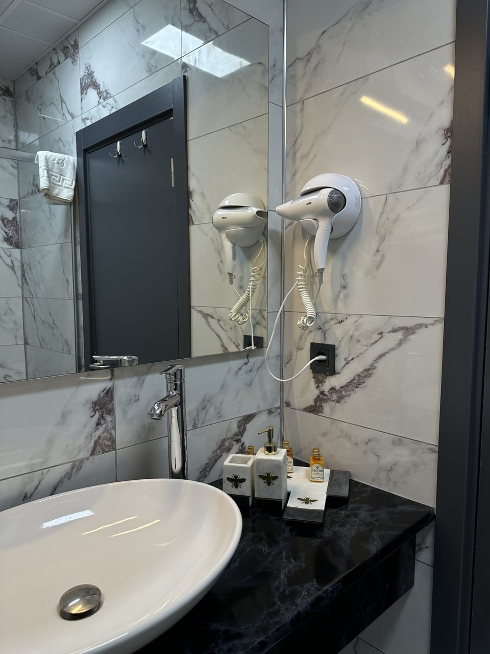 Shower, hair dryer, slippers, towels