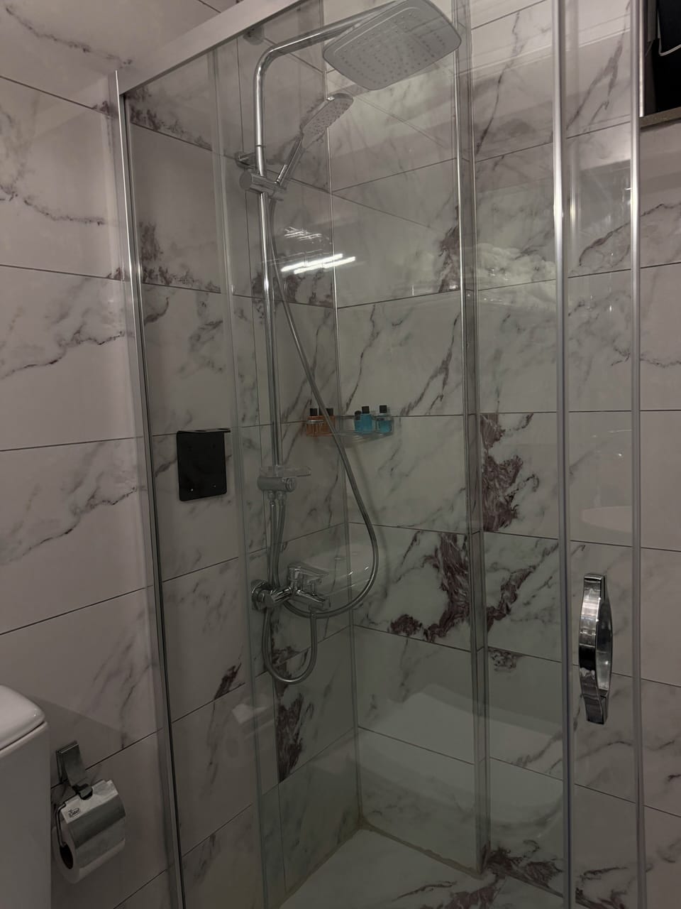 Shower, hair dryer, slippers, towels
