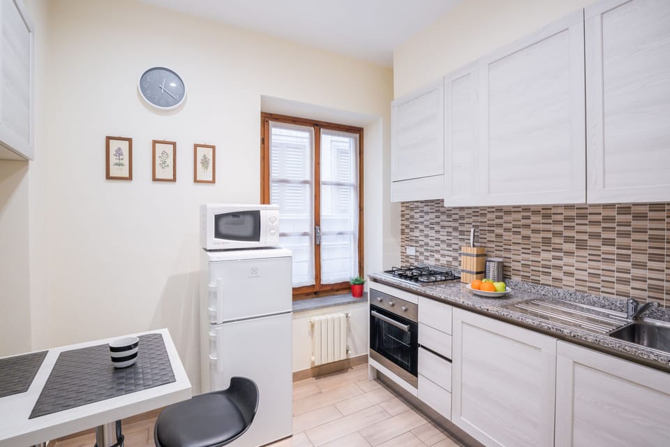 Design Apartment | Private kitchen | Full-size fridge, microwave, oven, stovetop