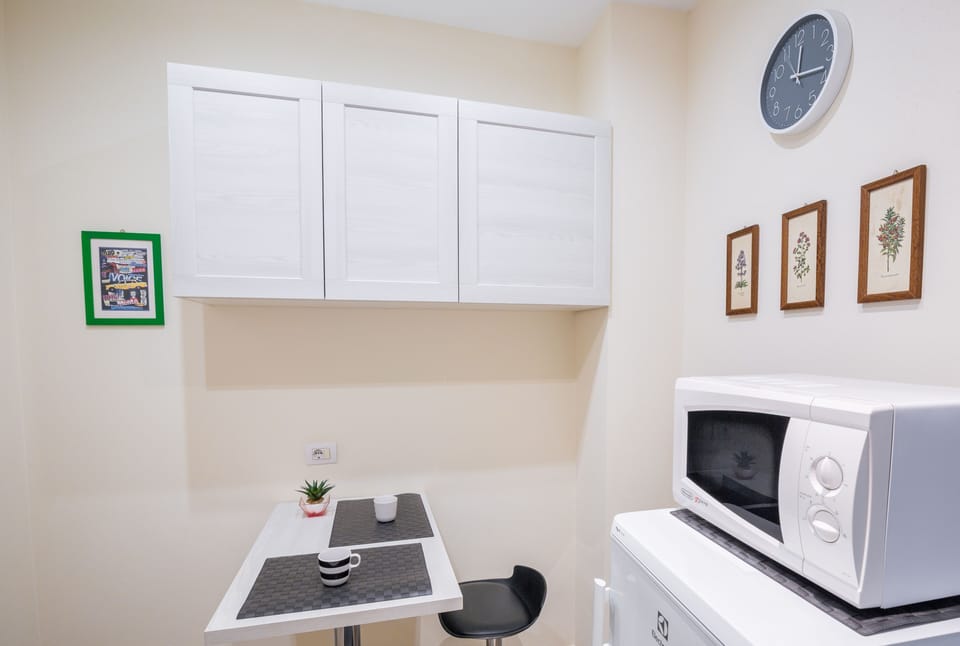 Design Apartment | Private kitchen | Full-size fridge, microwave, oven, stovetop