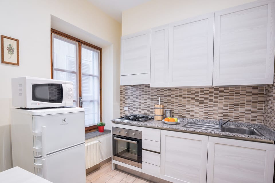 Design Apartment | Private kitchen | Full-size fridge, microwave, oven, stovetop