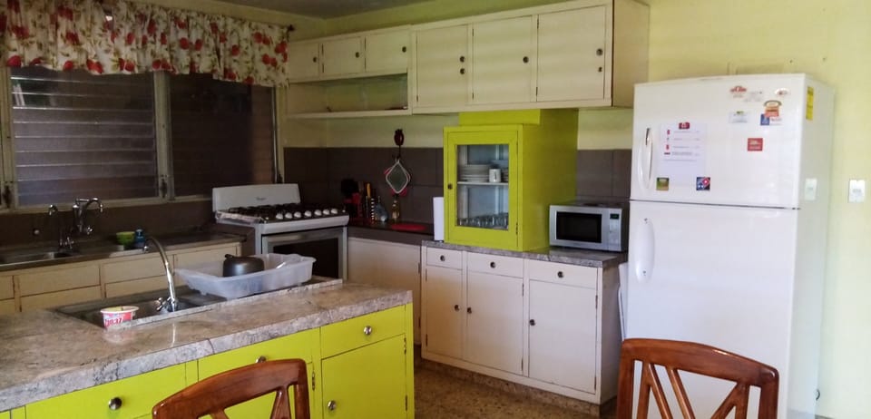 Mini-fridge, microwave, oven, cookware/dishes/utensils