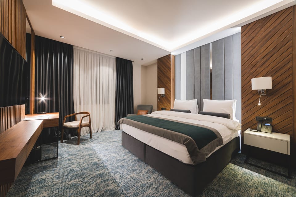 Deluxe Apartment, 1 Bedroom, City View | Premium bedding, pillowtop beds, minibar, in-room safe