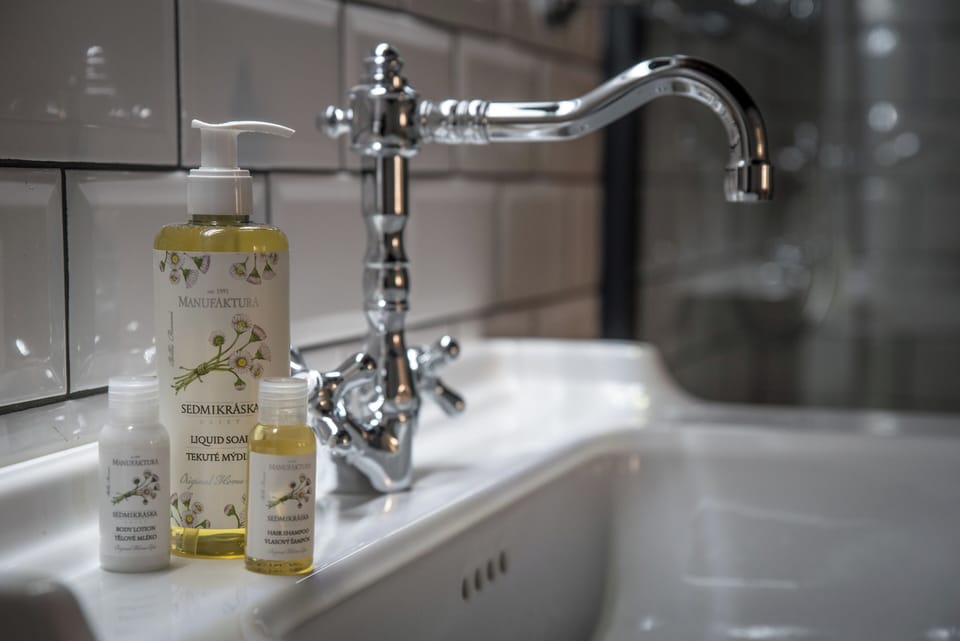 Designer toiletries, hair dryer, bathrobes, towels
