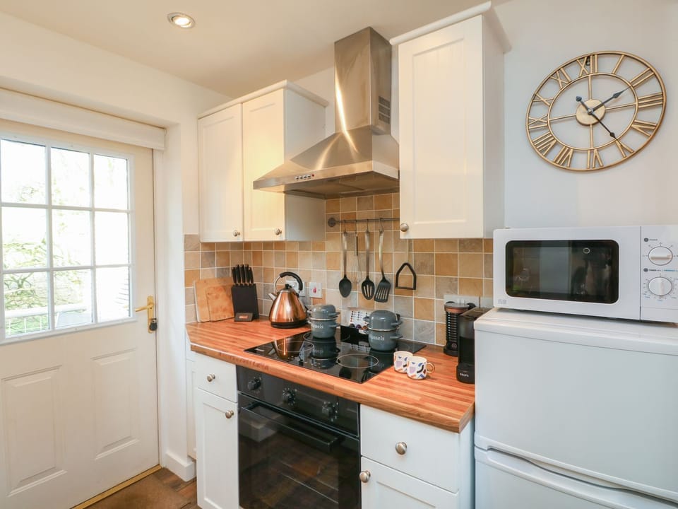 Fridge, electric kettle, toaster, cookware/dishes/utensils