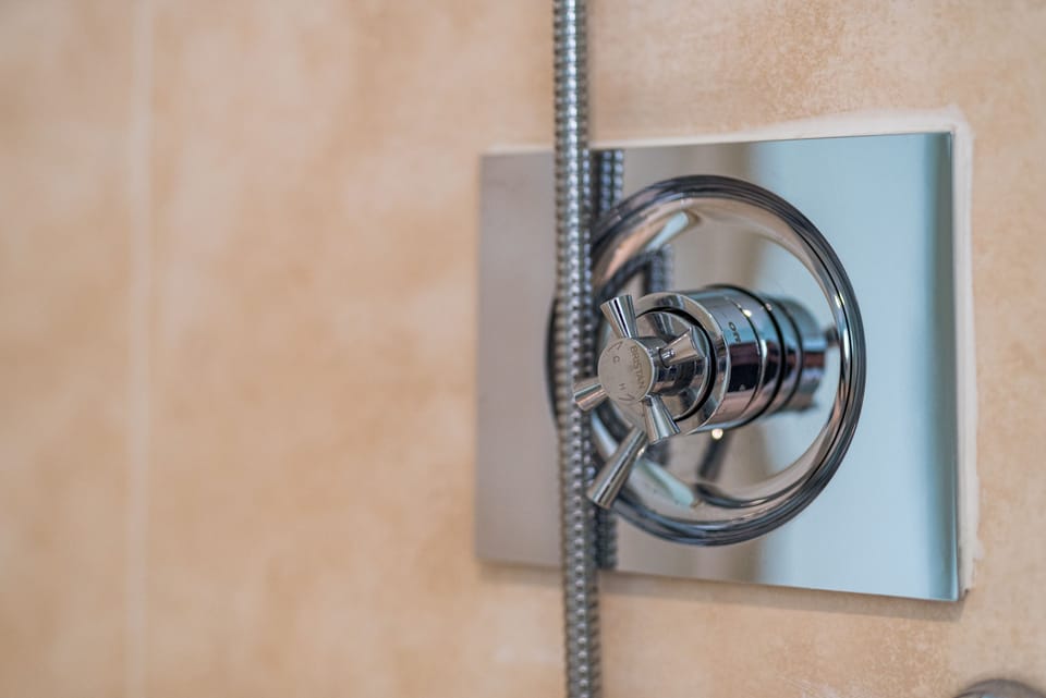 Superior Room | Bathroom | Shower, hair dryer, towels, soap