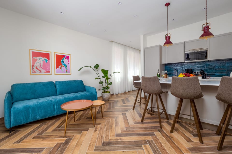 Exclusive Apartment | Living area | 50-inch flat-screen TV with digital channels, TV
