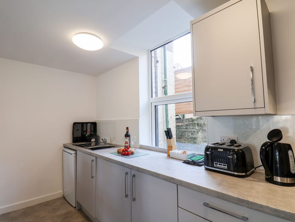 Fridge, electric kettle, toaster, cookware/dishes/utensils