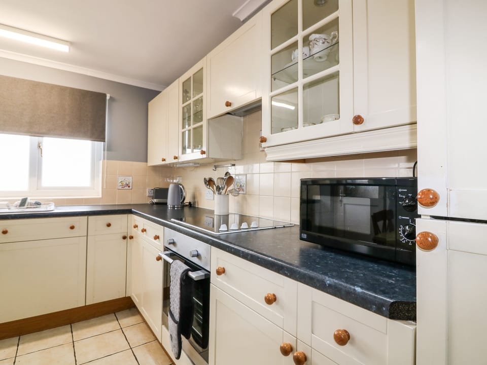 Fridge, electric kettle, toaster, cookware/dishes/utensils