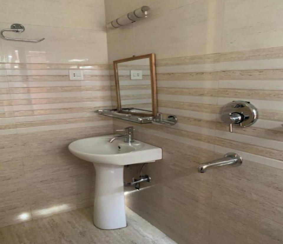 Shower, rainfall showerhead, towels, soap