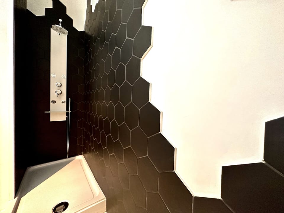 City House | Bathroom | Shower, hair dryer, towels
