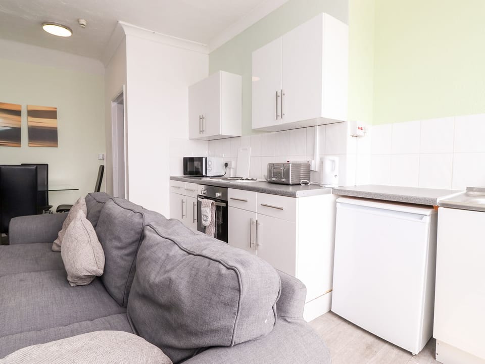 Fridge, electric kettle, toaster, cookware/dishes/utensils