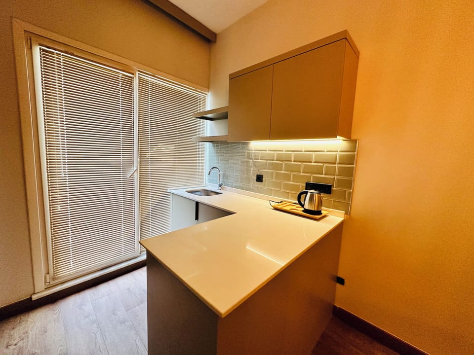 Family Triple Room | Private kitchen | Electric kettle