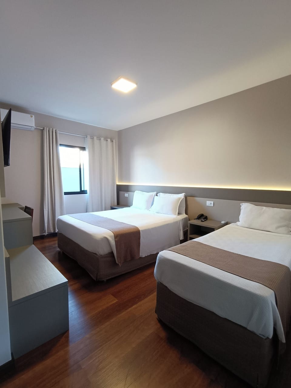 Deluxe Triple Room | Hypo-allergenic bedding, minibar, desk, laptop workspace