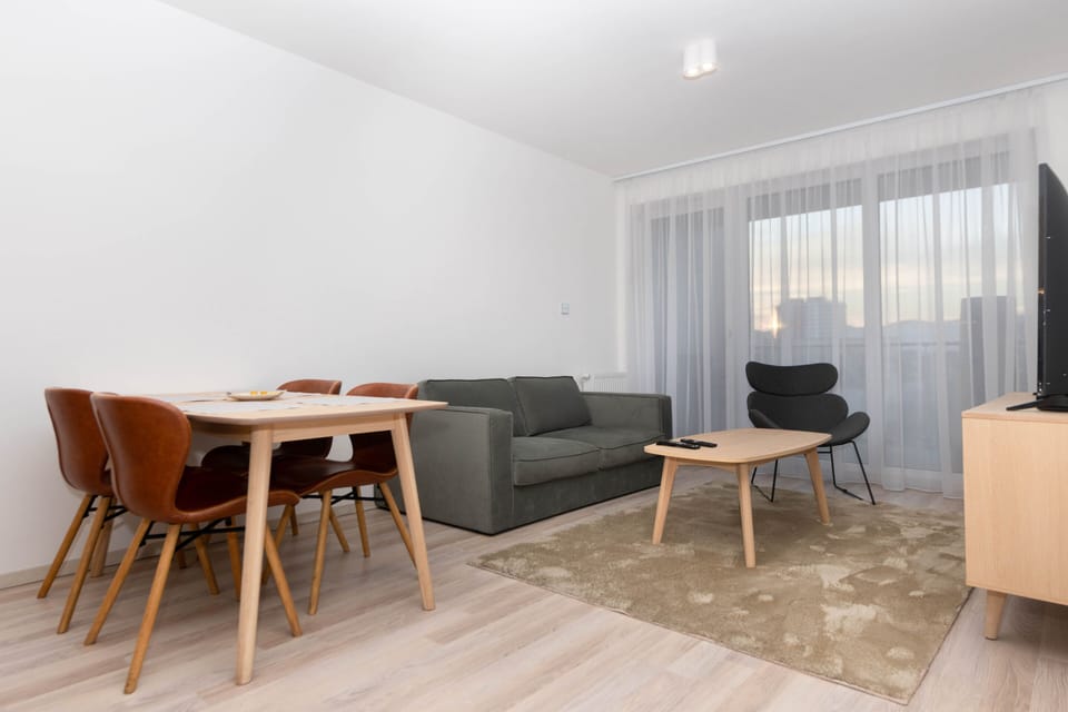 Deluxe Two-Bedroom Apartment with Balcony | Living area | 110-cm Smart TV with digital channels