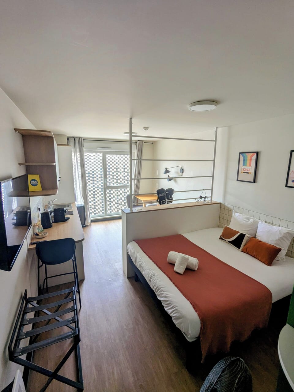 Premium bedding, desk, laptop workspace, soundproofing