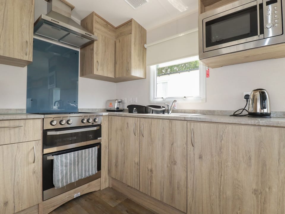 Fridge, electric kettle, toaster, cookware/dishes/utensils