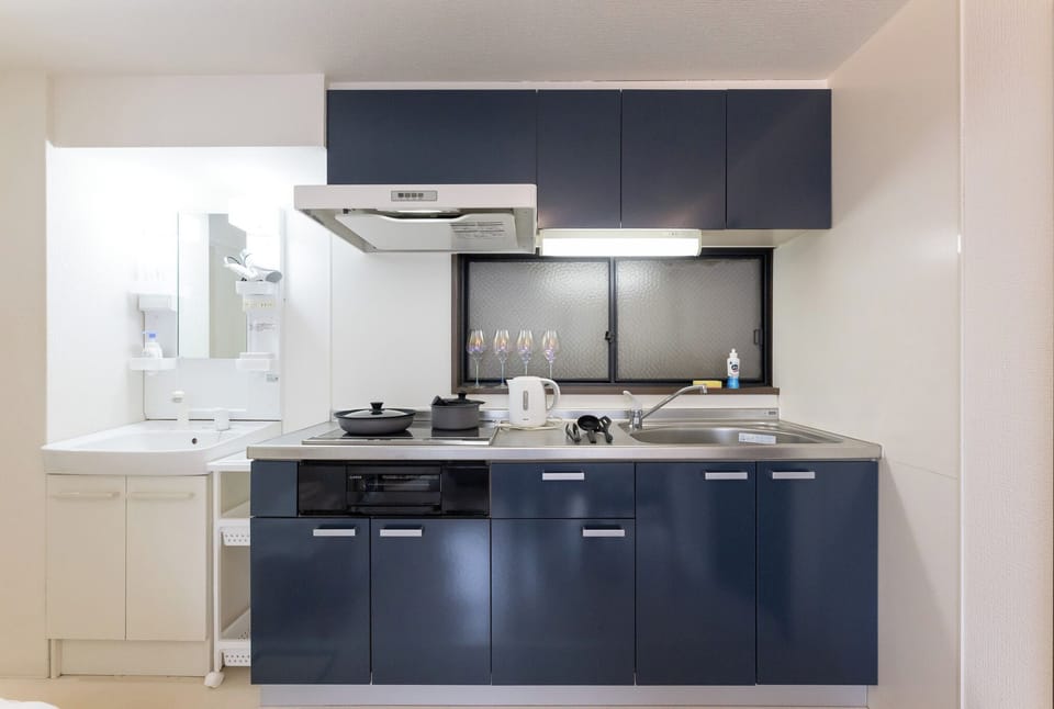 City Apartment | Living area | 32-inch flat-screen TV with digital channels