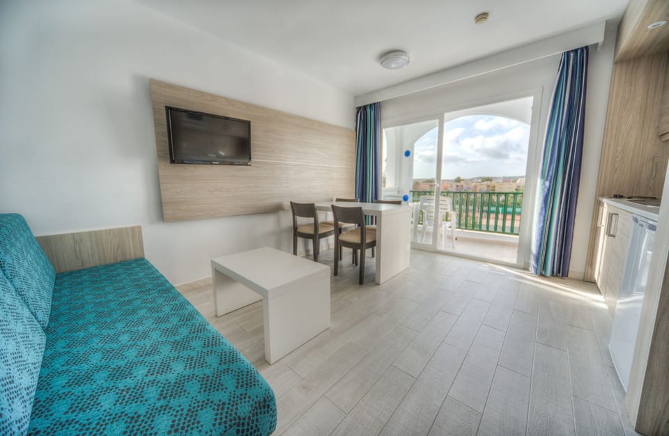 Family Apartment, 1 Bedroom, Balcony | Living room | 36-inch flat-screen TV with satellite channels, TV