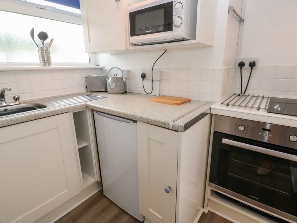 Fridge, electric kettle, toaster, cookware/dishes/utensils
