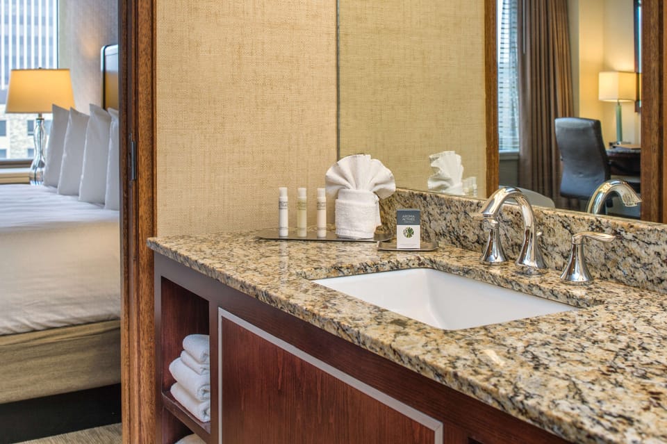 Designer toiletries, hair dryer, towels
