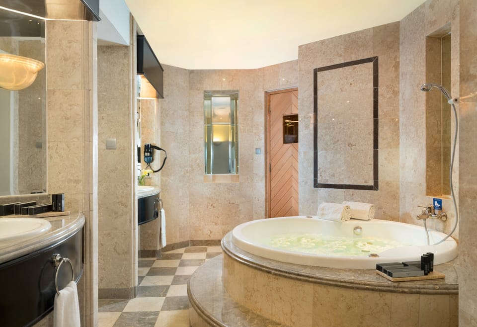Separate tub and shower, eco-friendly toiletries, hair dryer, slippers
